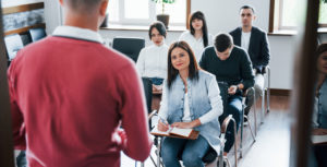 group of people at business conference in modern classroom at daytime